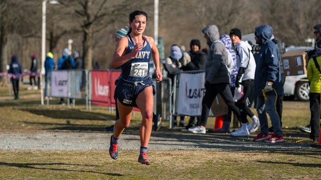 Navy Ensign Elizabeth Sullivan running at a cross country event.