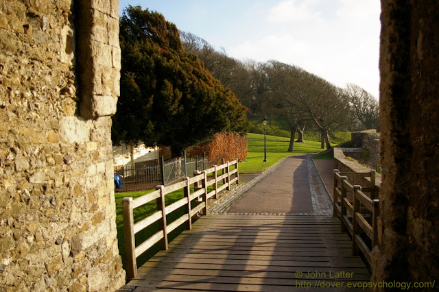 Knight's Road runs from drawbridge towards Canons Gate. Western Curtain Wall and Gatton's Tower on right; Georgian Sergeant Major's House on left. Peverell Tower and Sgt-Major's House are English Heritage Holiday Cottages. Listed Building and Ancient Monument.