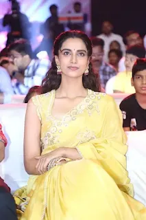 Meenakshi Chaudhary Stuns in Yellow Saree at Sankranthiki Event