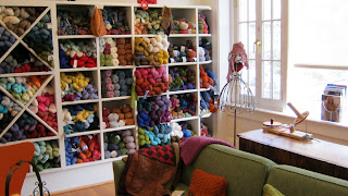 cubbies of yarn at Looped