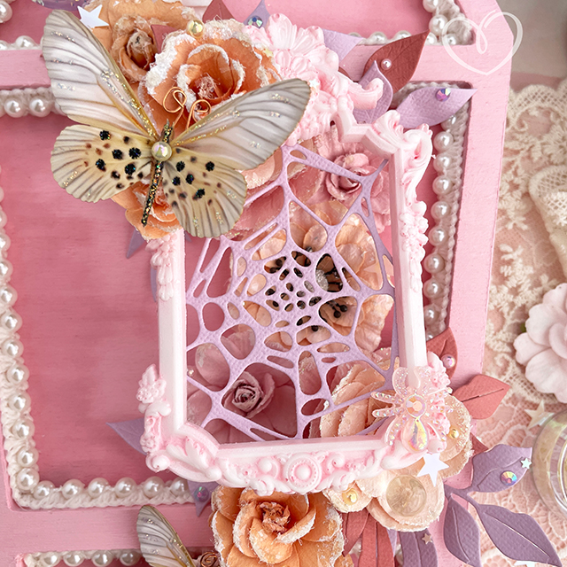 Halloween pink coffin mixed media vignette created with Sizzix paint and dies, Prima Marketing flowers, Reneabouquets butterflies, Tim Holtz Distress oxide, plus lace and pearl trim.