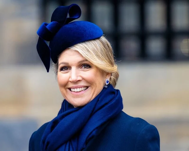 Queen Maxima wore a navy blue wool coat and, blue silk dress by Natan. Kim Keon Hee wore a green wool coat by Max Mara