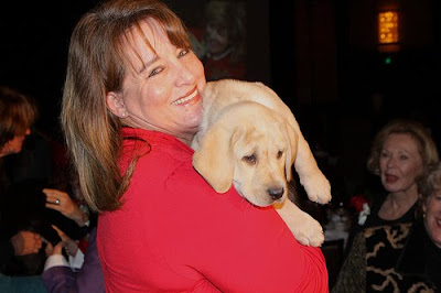 Puppy raiser Ellen Aguirre with yellow Lab Addison