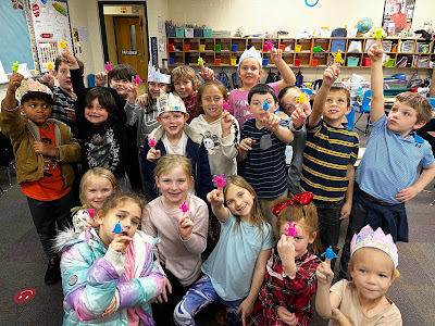 Students showing off their finger puppets