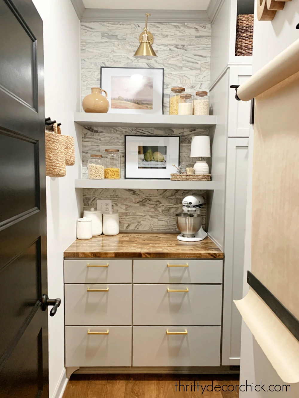 pantry with kitchen cabinets