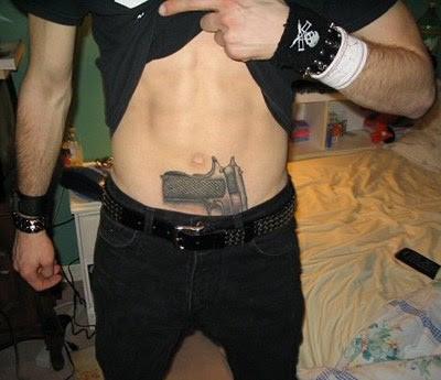 gun tattoos on hips