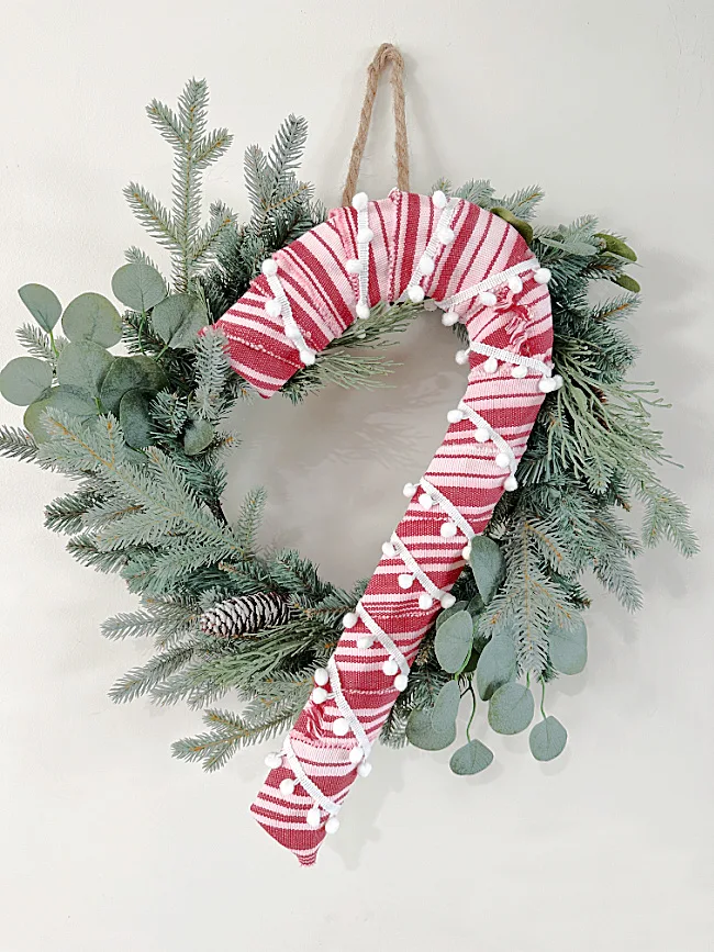 candy cane on pine wreath
