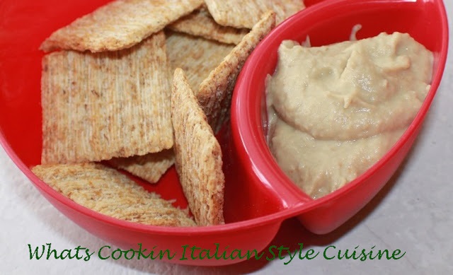 eggplant hummus in a split red bowl with crackers
