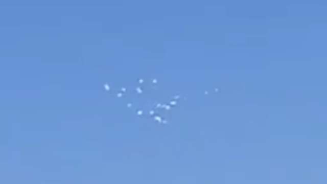 UFO cluster over Nevada's Area 51 seem to disappear and reappear.