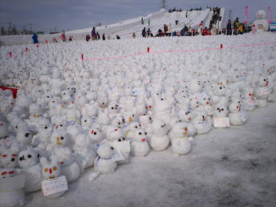 field of tiny snowmen