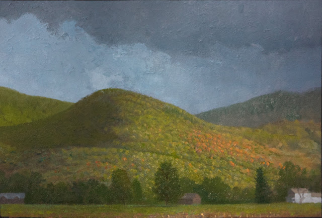 Oil painting of small hill under gray sky with bright sunlight illuminating orange and green foliage. Trees and farm houses in foreground.