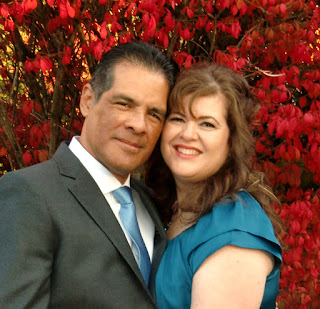 Mona-Rae and Carlos are framed by brilliant red leaves at The Salish Lodge & Spa