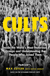 book cover of Cults with a crowd of people with arms raised.