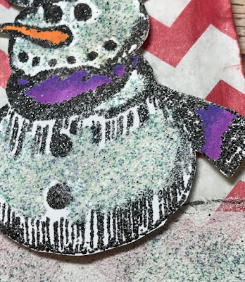 embossed snowman with a purple & pink scarf