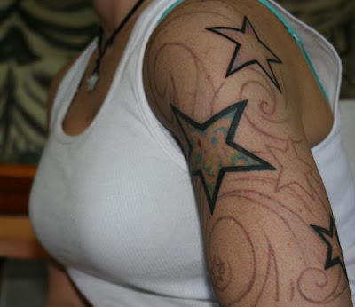 Beautiful dancing stars tattoo on the arm.