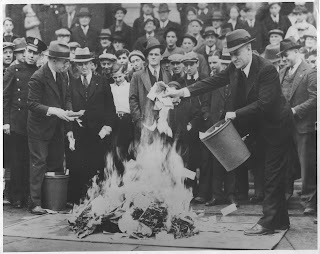 Crowds gather as hundreds of thousands of dollars in 'Scrip Money' are burned. The notes were issued after the bank had closed. April, 1933. Local Identifier: 306-NT-177.567C - Source: http://unwritten-record.blogs.archives.gov/page/8/