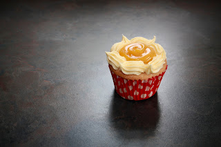 Vanilla cupcakes with passion fruit curd and passion fruit buttercream