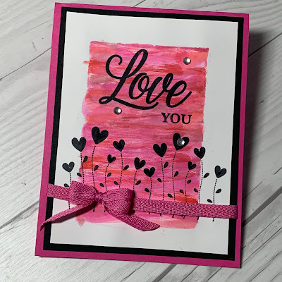 Valentine flowers with Love You sentiment on a Valentine Card