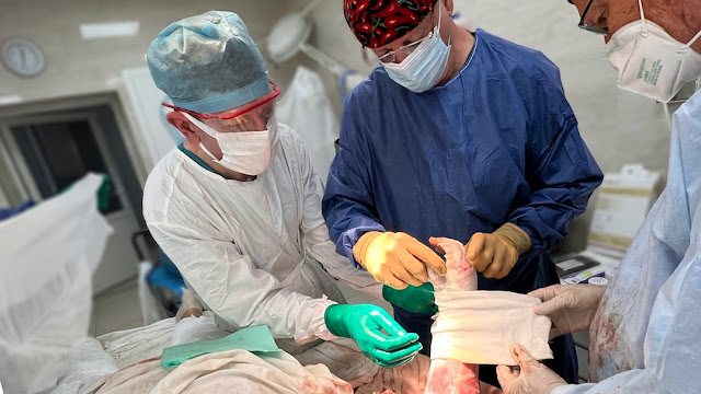 A visiting surgical team led by retired Air Force Col. (Dr.) Warren Dorlac, a Uniformed Services University alumnus and associate professor of Surgery cares for combat victims in Lviv. (Photo credit: Warren Dorlac, Kelley Thompson, Jay Johannigman)