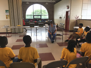 Laurel talks to Day campers at East Side Community Center