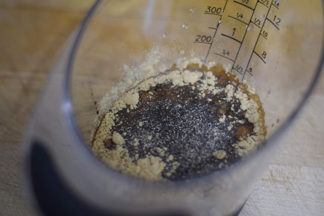 The ingredients for the marinade in a mixing cup. 