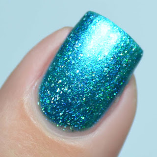 sapphire blue nail polish with holographic flecks