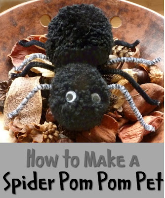 Black spider made from yarn pom poms