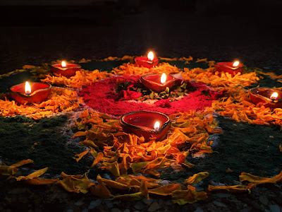 Diya's lit up during Diwali outside and inside home