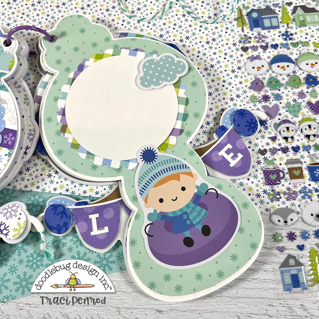 Snowman Shaped Scrapbook Album page made with a Doodlebug Design paper collection