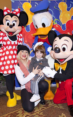 Christina Aguilera and Max celebrating at Disneyland