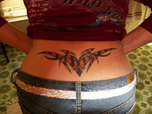 lower back tattoo for women. low-ack-tattoos-for-women