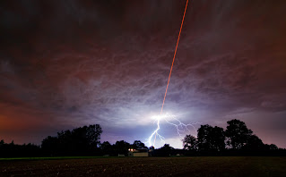 Laser meets lightning | ESO/M. Kornmesser