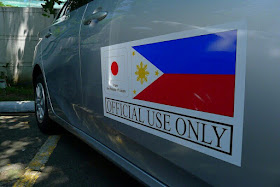 The Japanese government, through its Non-Project Grant Aid, has funded the purchase of P250-Million worth of Toyota Prius Hybrid cars. They did this to support the Philippine Government, specifically the Department of Energy's campaign to promote energy efficiency and clean air across the country. The DOE will distribute the cars to replace some service vehicles of national government offices with hybrid cars. Officials of the Energy Utilization Management Bureau and Japan’s Ambassador to the Philippines, Kazuhide Ishikawa, turned over the hybrid Toyotas to the beneficiaries last Friday at the DOE Sunken Garden in Taguig.  The Non-Project Grant Aid (NPGA) is part of the Japan International Cooperation System. A hybrid car is called such because it is powered two different ways. It has an optimized fuel engine while also having an electric motor to provide another means of moving the vehicle. Using a computer, the car can move by either mechanism or both at the same time, depending on the driving conditions. The electric motor is usually for slow speed. The fuel engine comes in when more power is needed. Also, when the car is on a downhill road, or when the car is cruising, the batteries are actually being charged by the electric motor. This increases the efficiency of the car. In uphill climbs, the motor assists the fuel engine so that less fuel is also used. This is how hybrid vehicles attain the highest energy efficiency. The best part is that hybrid cars have lower carbon emission, making it more environmentally friendly. The beneficiaries of the hybrid cars include the Office of the President, Department of the Interior and Local Government (DILG), Department of Finance (DOF), Department of Foreign Affairs (DFA), Department of Budget and Management (DBM), Department of Transportation, Department of Tourism (DOT), Department of Trade and Industries (DTI), Department of Environment and Natural Resources (DENR), National Economic Development Authority, Department of Science and Technology (DOST) and the Philippine National Police. Eight hybrid cars will also be given to government offices in Region 8, including the DENR, DTI, DOST, Bureau of Fire Protection, Philippine Information Agency, Land Transportation Office and the Regional Disaster Risk Reduction and Management Council. They were given priority to support the recovery of the local government and the many communities devastated by Super Typhoon Yolanda in 2013. “This Japan government-aided grant will jump-start our drive towards our call to action to our fellow public servants to increase their use or patronize energy efficient technologies, including their official vehicles. We have to be the role model in this cause, so our people can look up to us and follow our lead,” Energy Secretary Alfonso Cusi said. In the Philippines, a compact version of Prius is available, the Prius C. Toyota Philippines website quotes the price of the standard model at P1,639,000. The full options sells for P1,689,000.