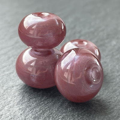 Handmade hollow lampwork glass beads made with CiM Almandine