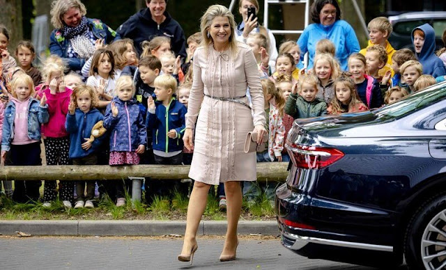 Queen Maxima wore a ruffle and leather accents dress by Valentino Spring 2011 Ready-to-Wear collection