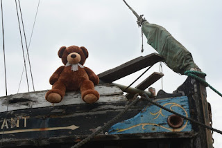 Brown Teddy Bear lookout on The Vigilant at Topsham Quay