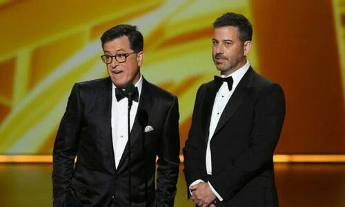 Stephen Colbert and Jimmy Kimmel speak onstage during the 71st Emmy Awards at Microsoft Theater in Los Angeles, California on Sept. 22, 2019.