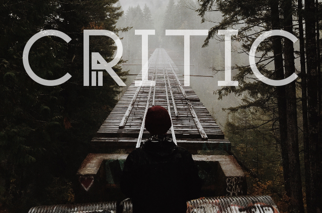 A woman crossing a bridge with the word critic written on it.
