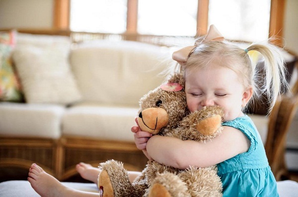 Baby Girl Playing With Teddy Bear