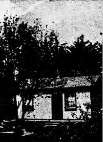 iage modest home of Joseph Scriven black and white image shows a small bungalow nestled among some trees. There is a broad low porch without a railing