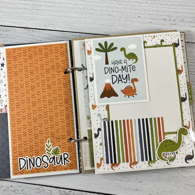 Be Fierce Dinosaur Scrapbook Album page with dinosaurs, volcanos, and trees