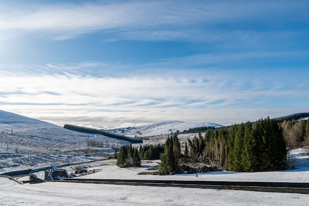 View from Backwater dam to a snow covered glen and hillsides