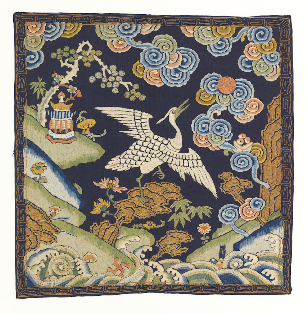 Chinese rank badge with a heron and various other designs, including swastika.