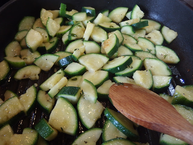 Stir frying the courgettes