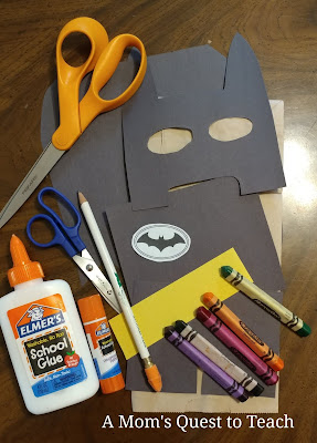 Batman paper bag puppet supplies; scissors, glue, construction paper