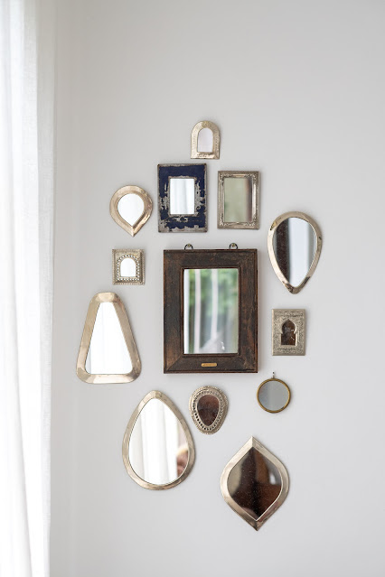Assorted styles of mirror on white wall:Photo by Elena Kloppenburg on Unsplash