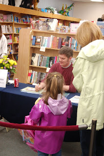 There he is, signing away