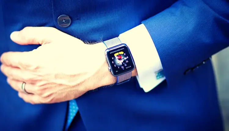 Image of a person wearing a suit with Letsfit E22 Smartwatch