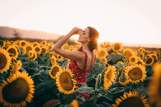 A girl on sunflower garden with summer outfit