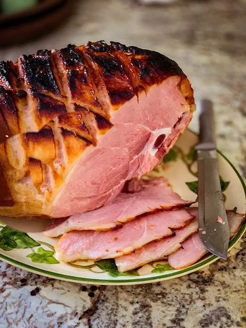 A Whole Bone In Ham recipe is so simple, with no glaze, no studding with cloves and no fuss.  The recipe uses the low and slow method of cooking and a blast of high heat at the end carmalizing the outside.  The results are excellent, juicy, tender, and superb flavor.